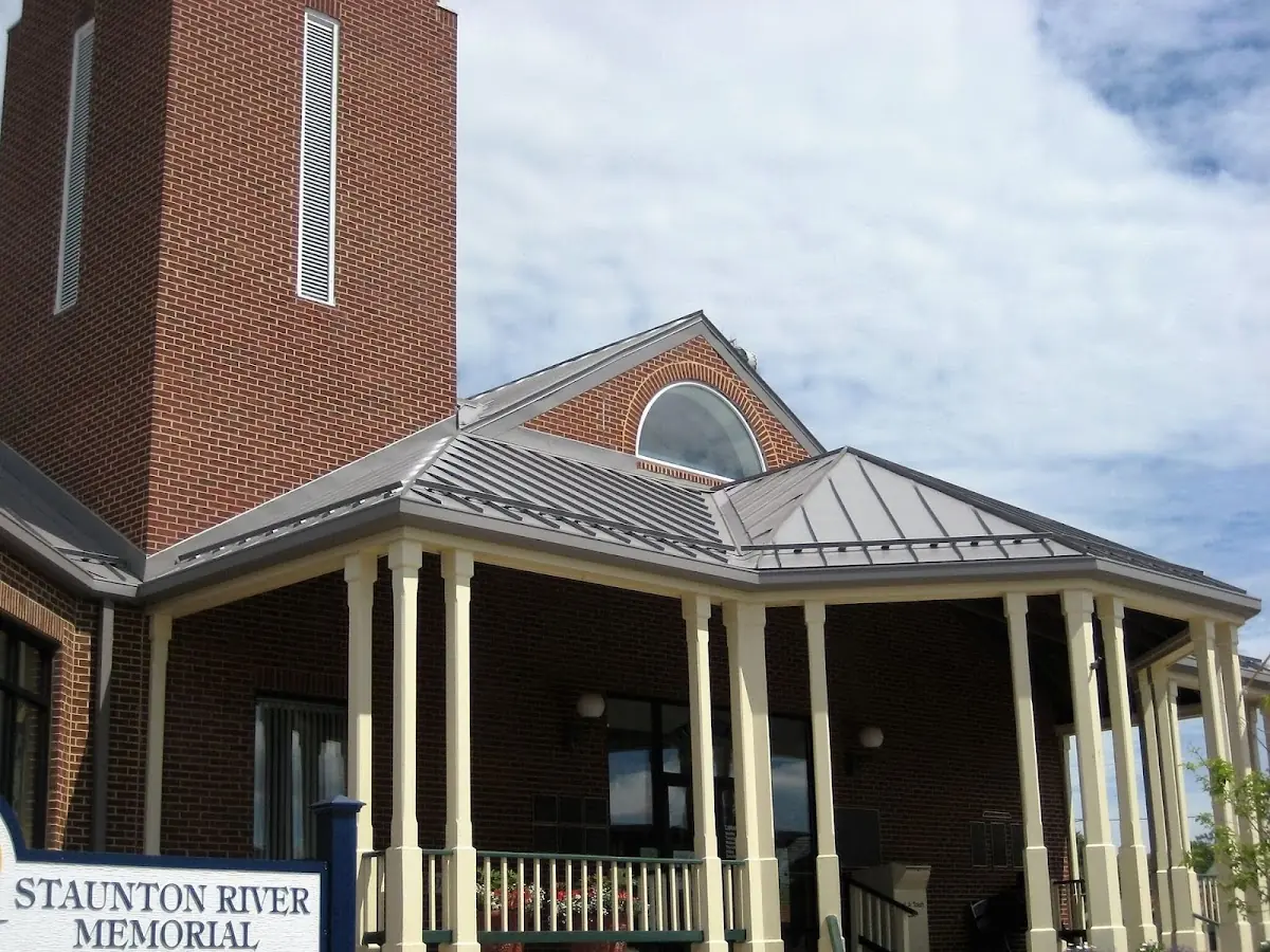 Skilled roofing craftsmen working on a residential roof in Carlisle